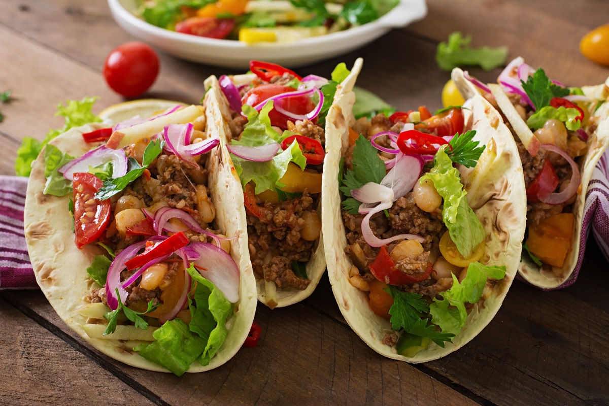 Plate of Vegetarian Chickpea Tacos with Fresh Herbs and Vegetables