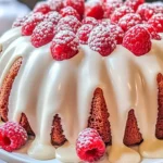 White Chocolate Raspberry Bundt Cake with fresh raspberries and white chocolate drizzle